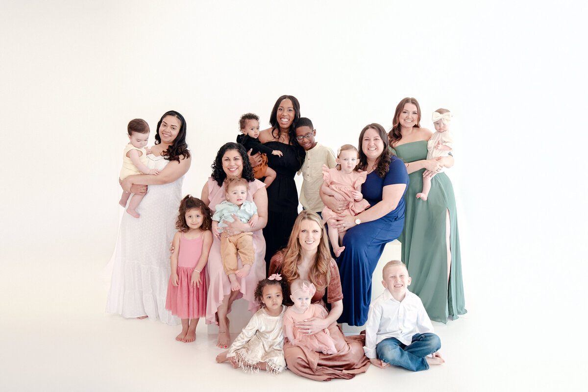Group of mothers posing together for the Motherhood Project