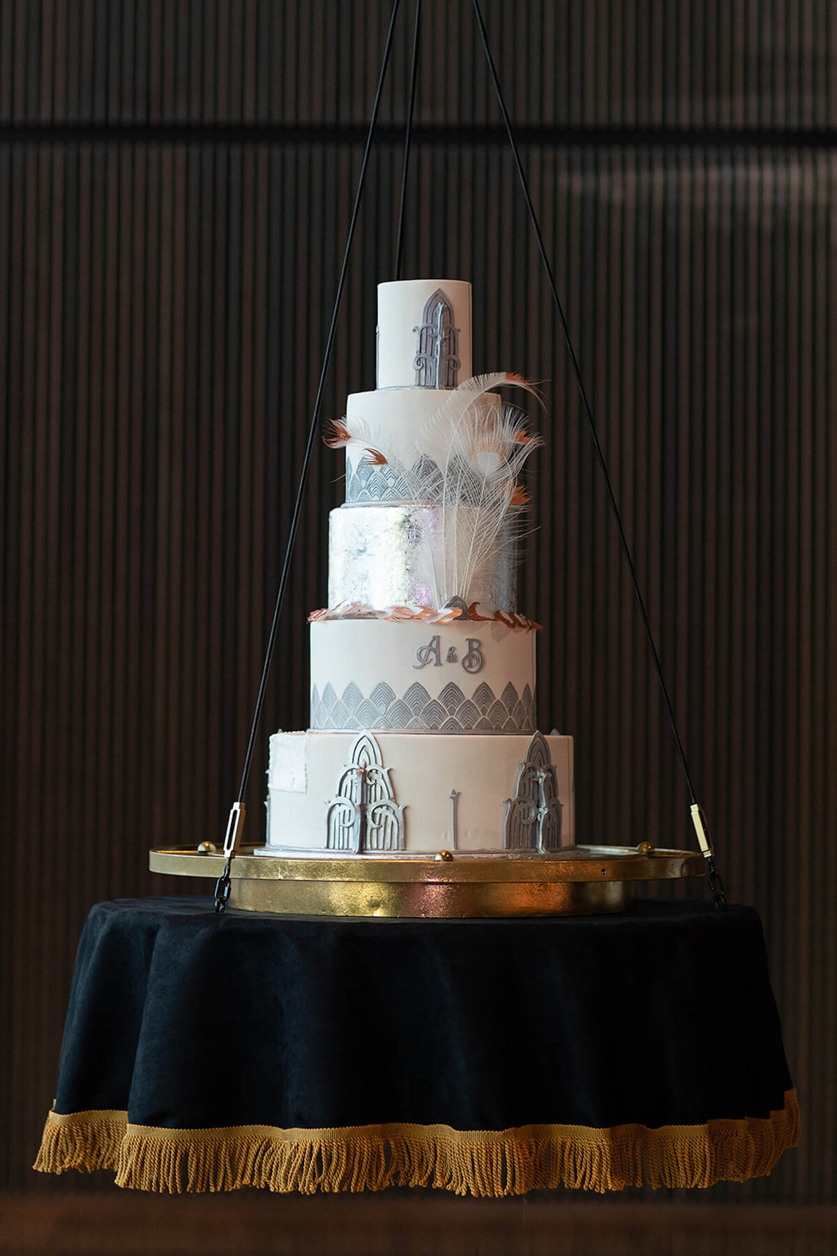Art decor wedding cake hanging and descending from ceiling