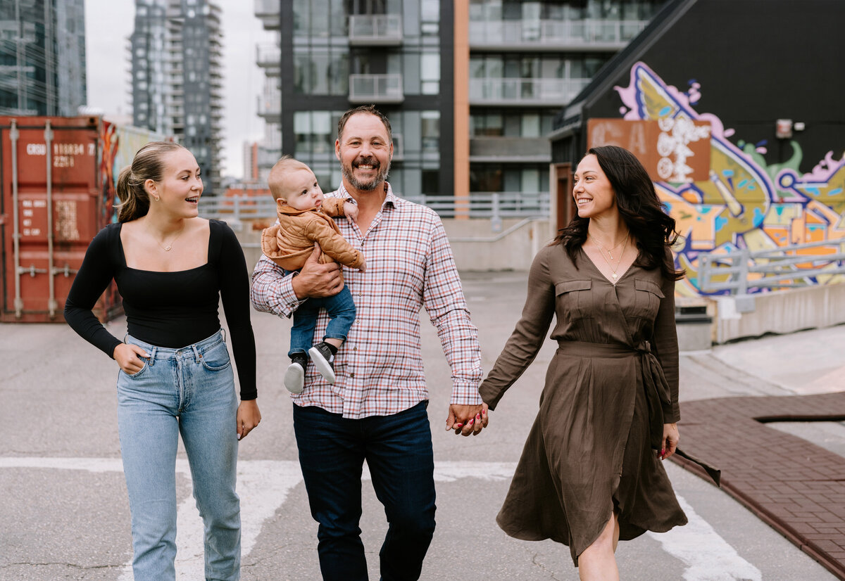 A family of four walk together in Calgary, Alberta