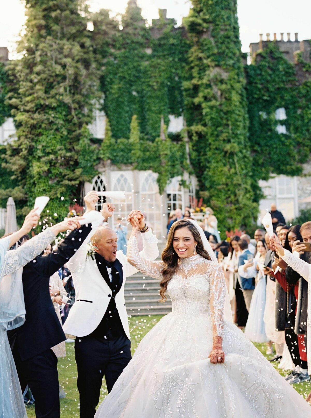 A photo of a wedding showing the couple celebrating after their ceremony at Luttrellstown Castle