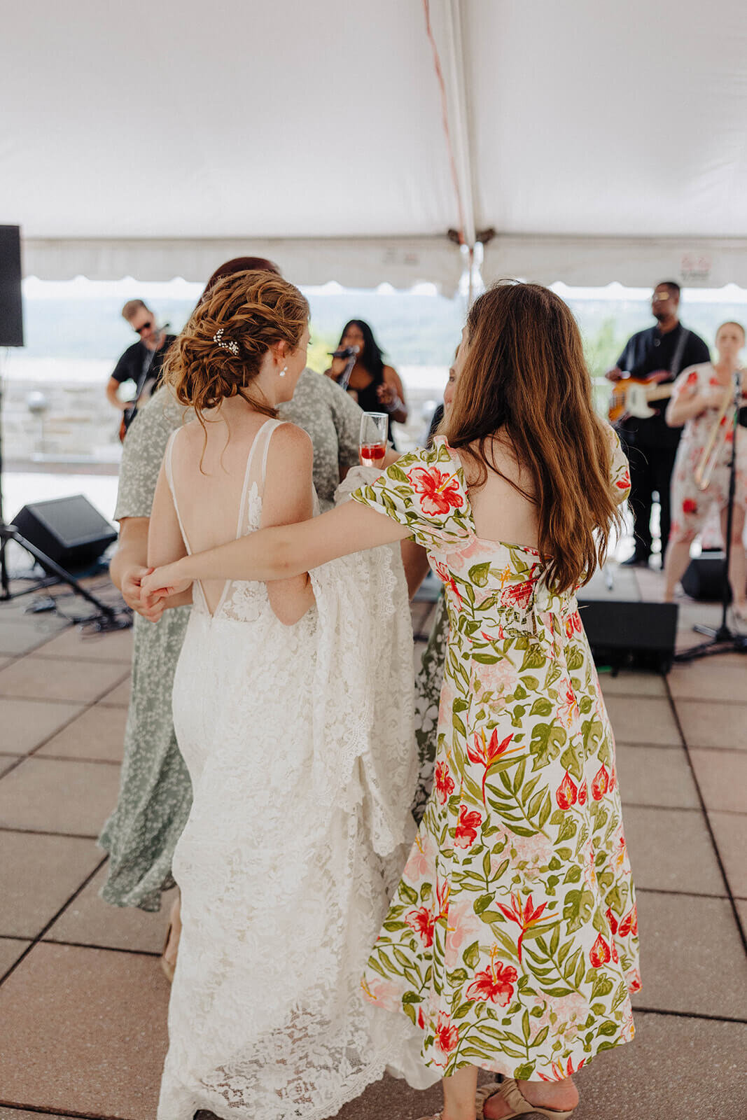 Bride and guests dancing at Cornell University wedding recpetion