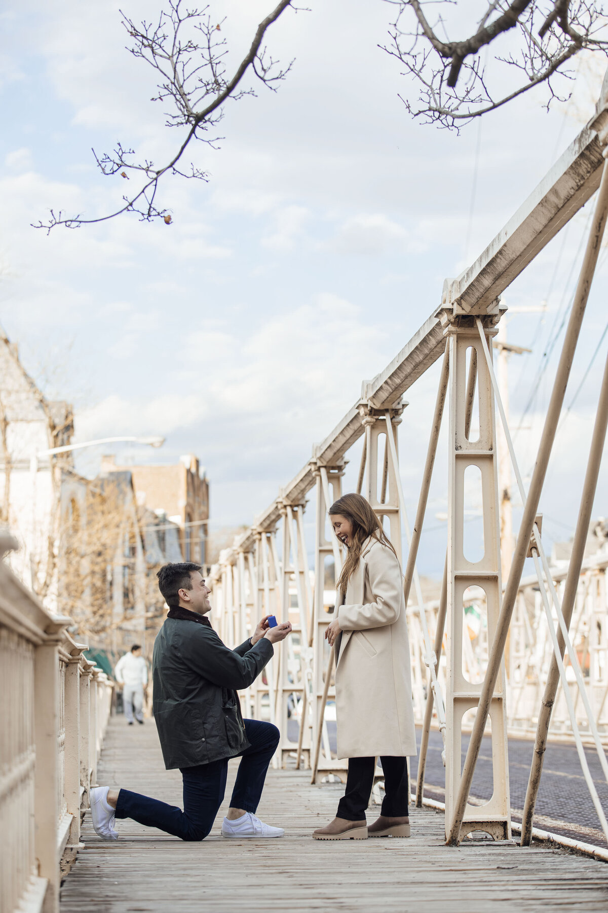 Proposal Photographer | Groom-to-be proposing on the iconic bridge overlooking the river and Red Mill Museum | Clinton, New Jersey