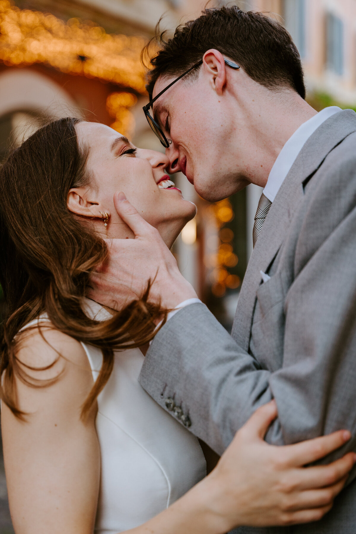 Romantic moment in a narrow Rome alleyway.