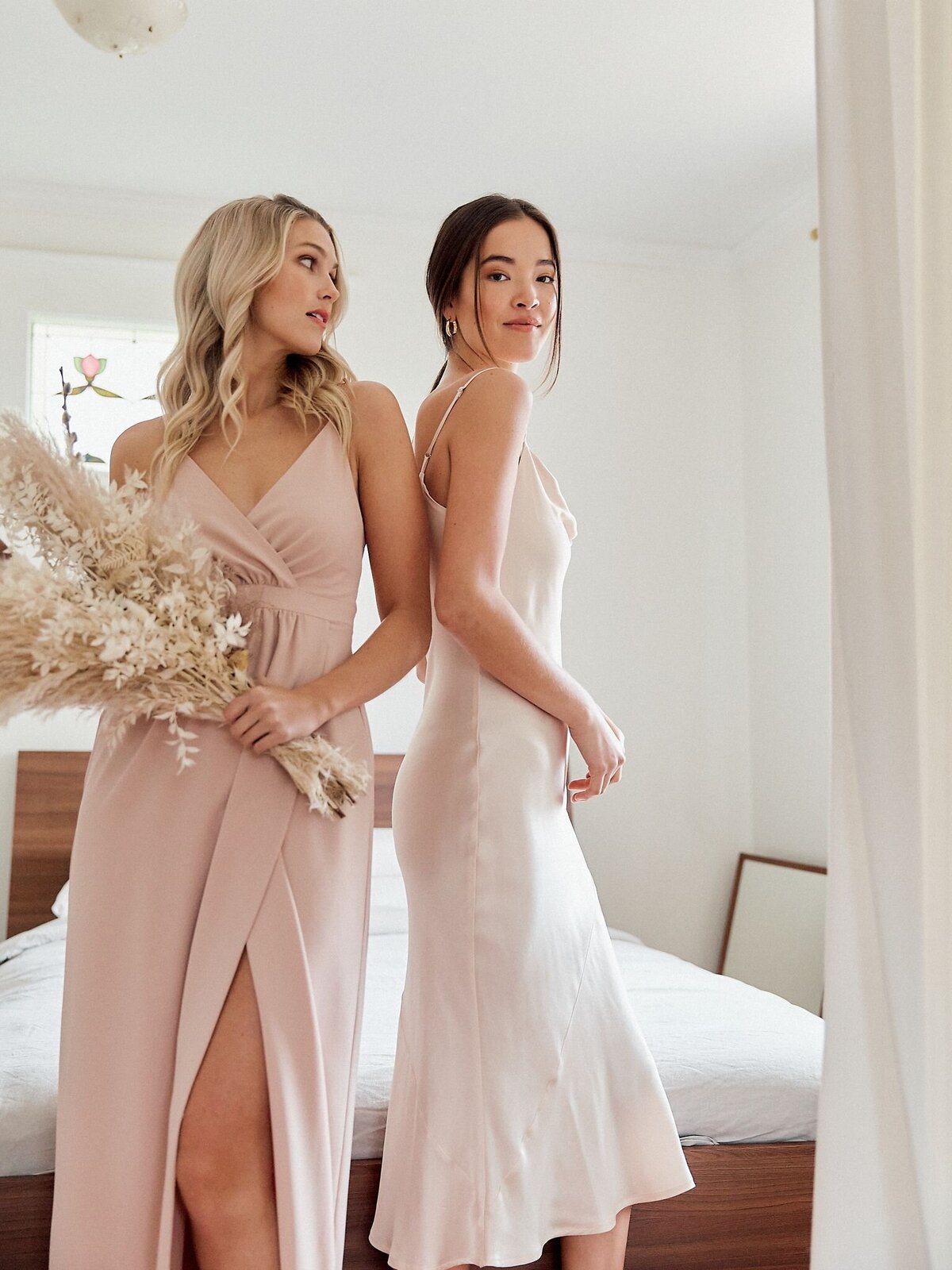Modern and romantic pink bridesmaids dresses by Park & Fifth, a modern bridal boutique based in Calgary, Alberta. Featured on the Brontë Bride Vendor Guide.
