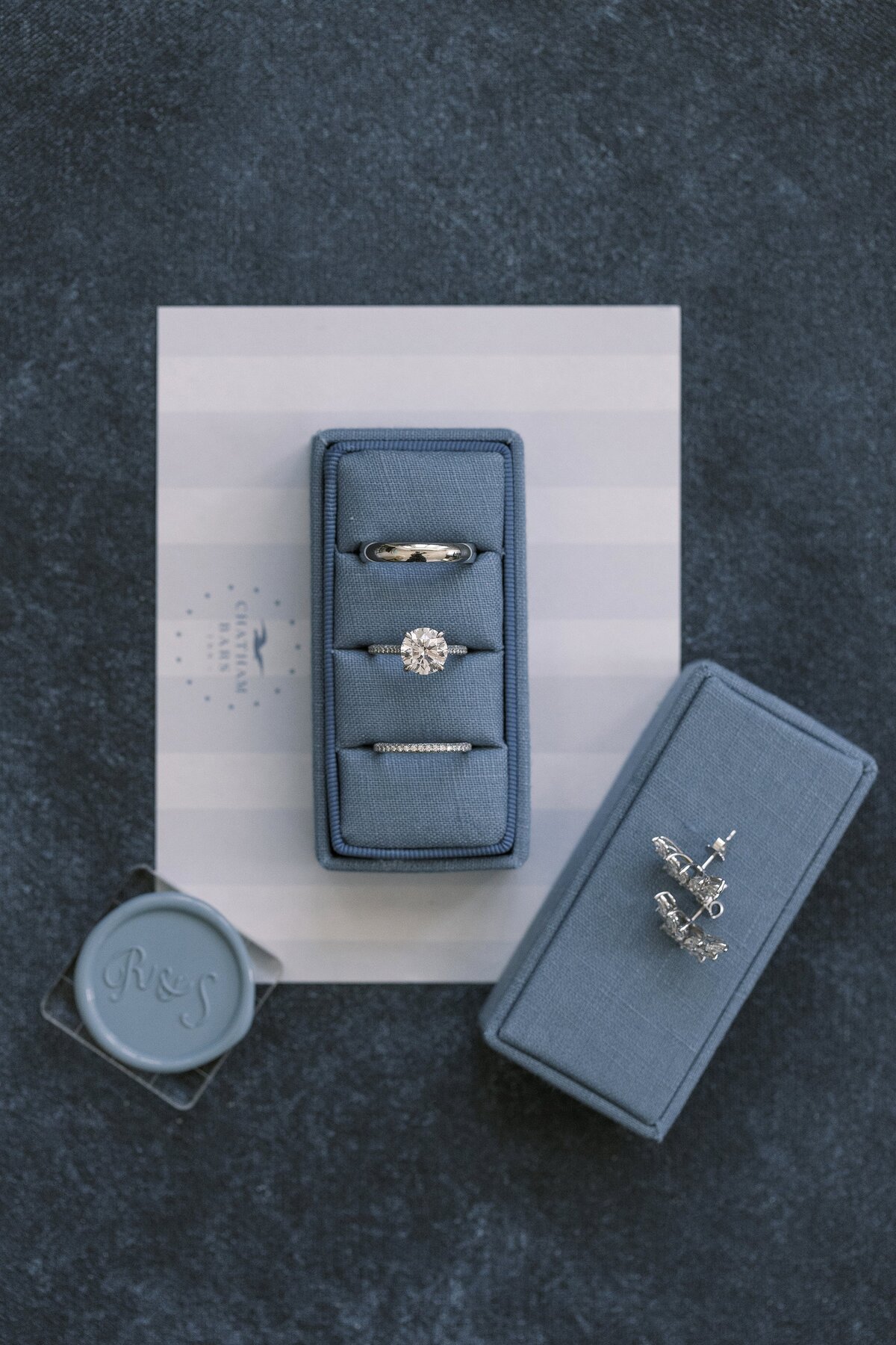 Wedding rings on stationary at Chatham Bars Inn. Deborah Zoe Photography