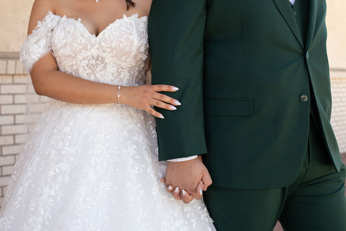 Bride and groom holding hands during their Utah wedding, captured by Lamblight Photography