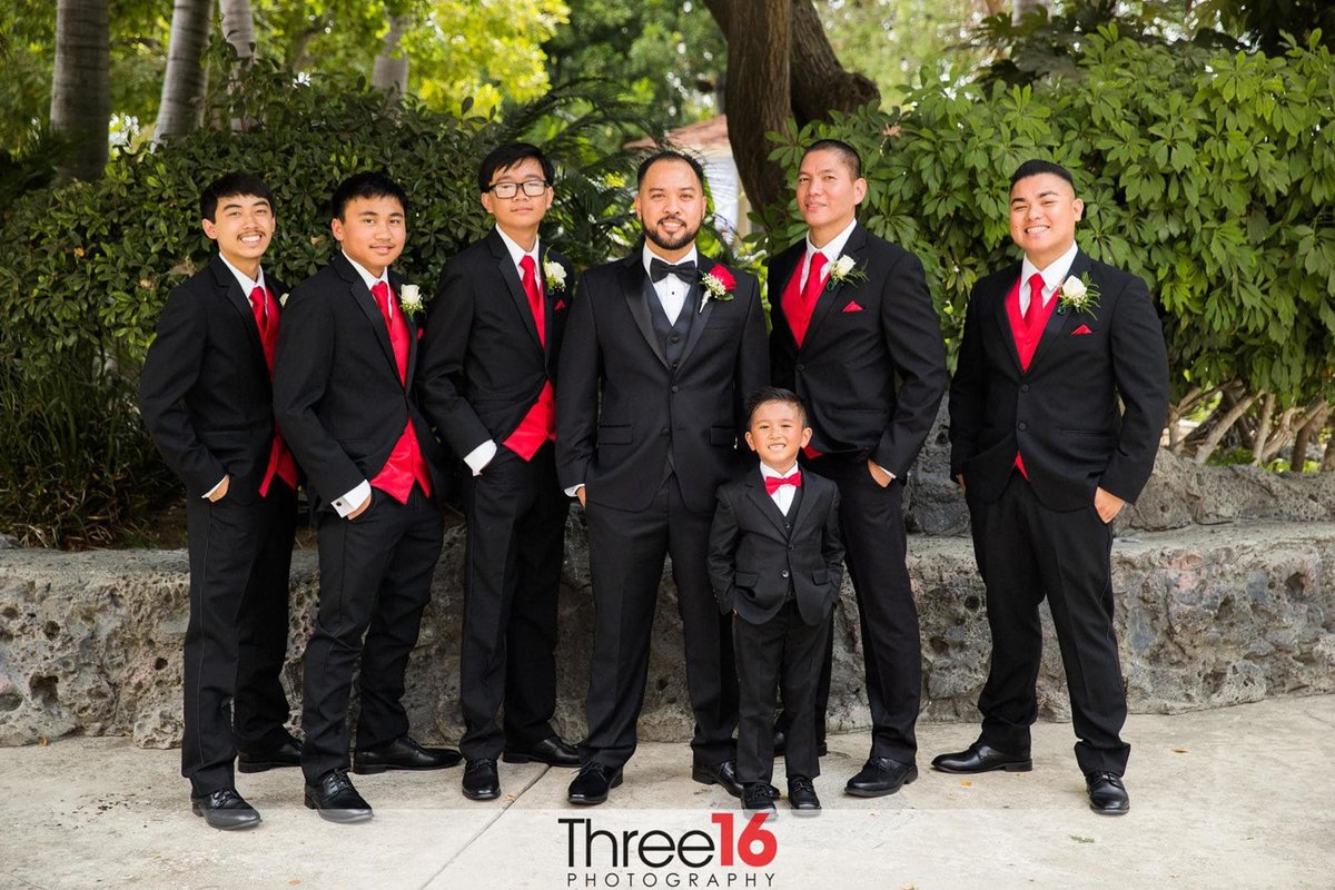 Groom posing with his Groomsmen