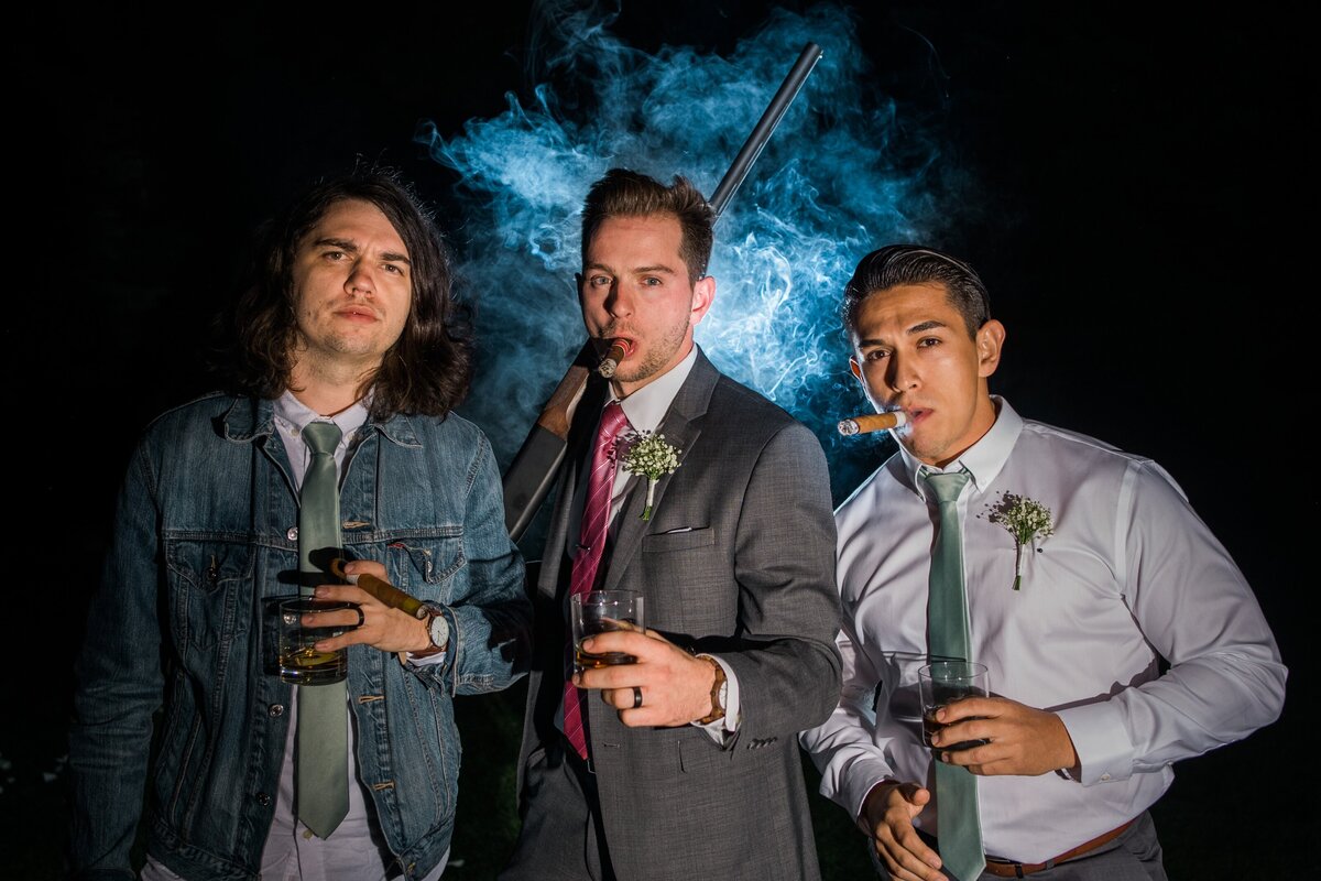 fun groomsmen photo smoking cigars
