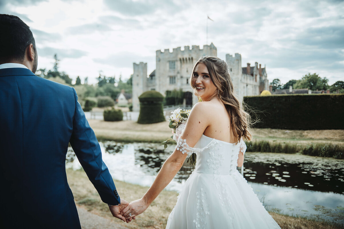 bride-and-groom-walking-hever-castle-wedding
