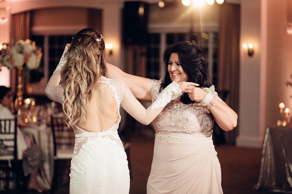 Wedding Photograph Of Woman Smiling While Dancing With The Bride Los Angeles