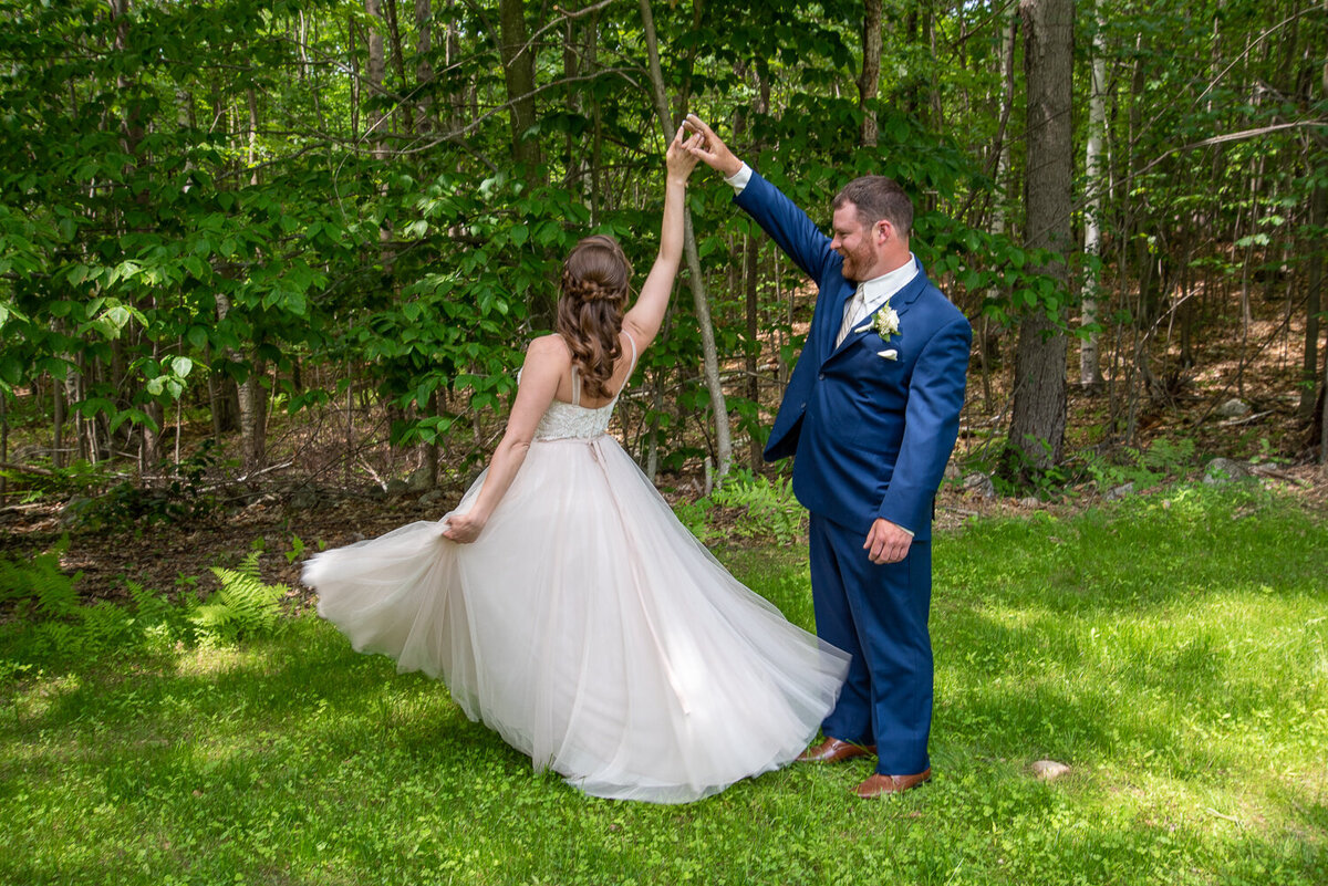 Groom spinning his bride around