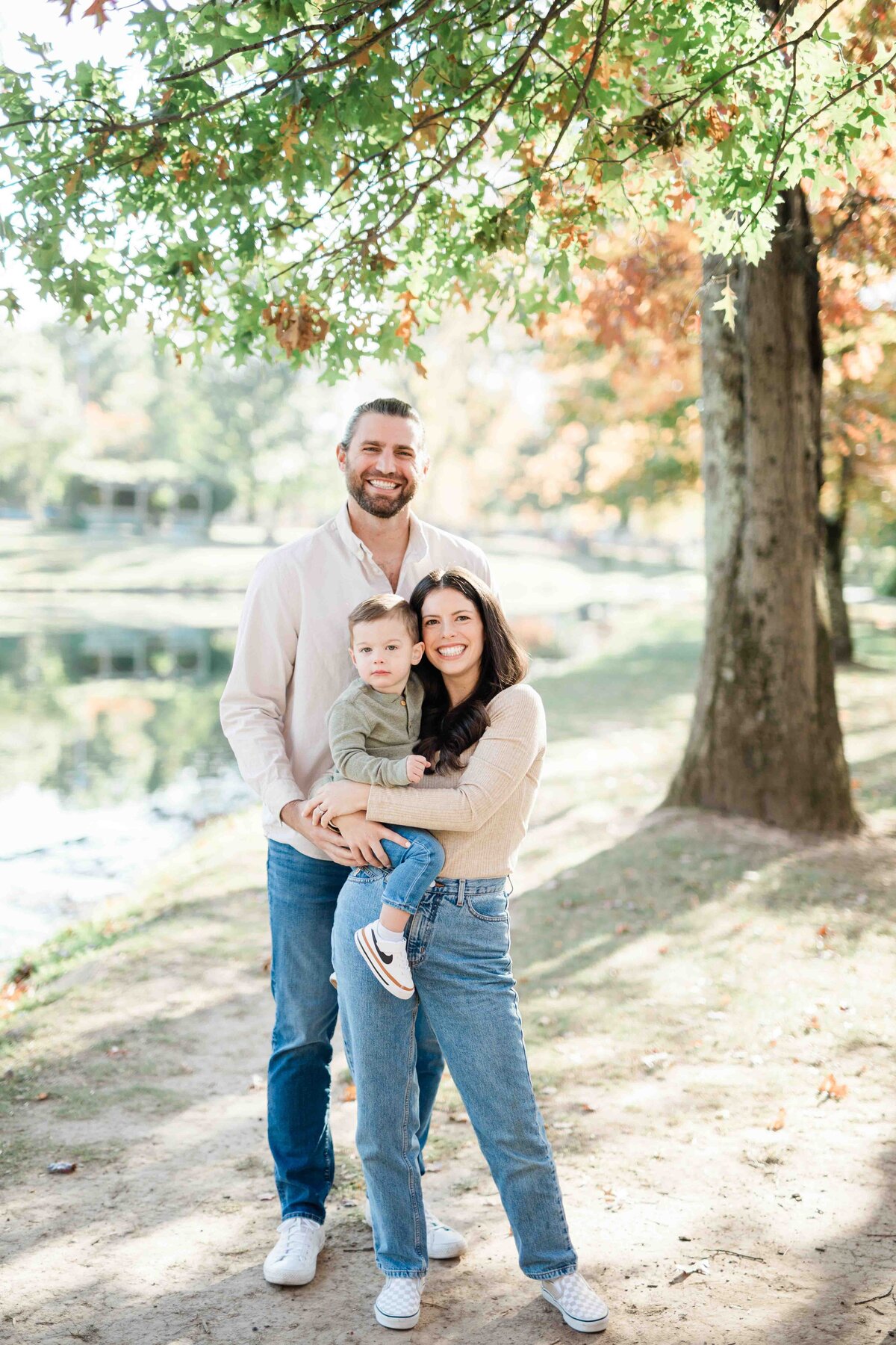 Parents smiling with young child
