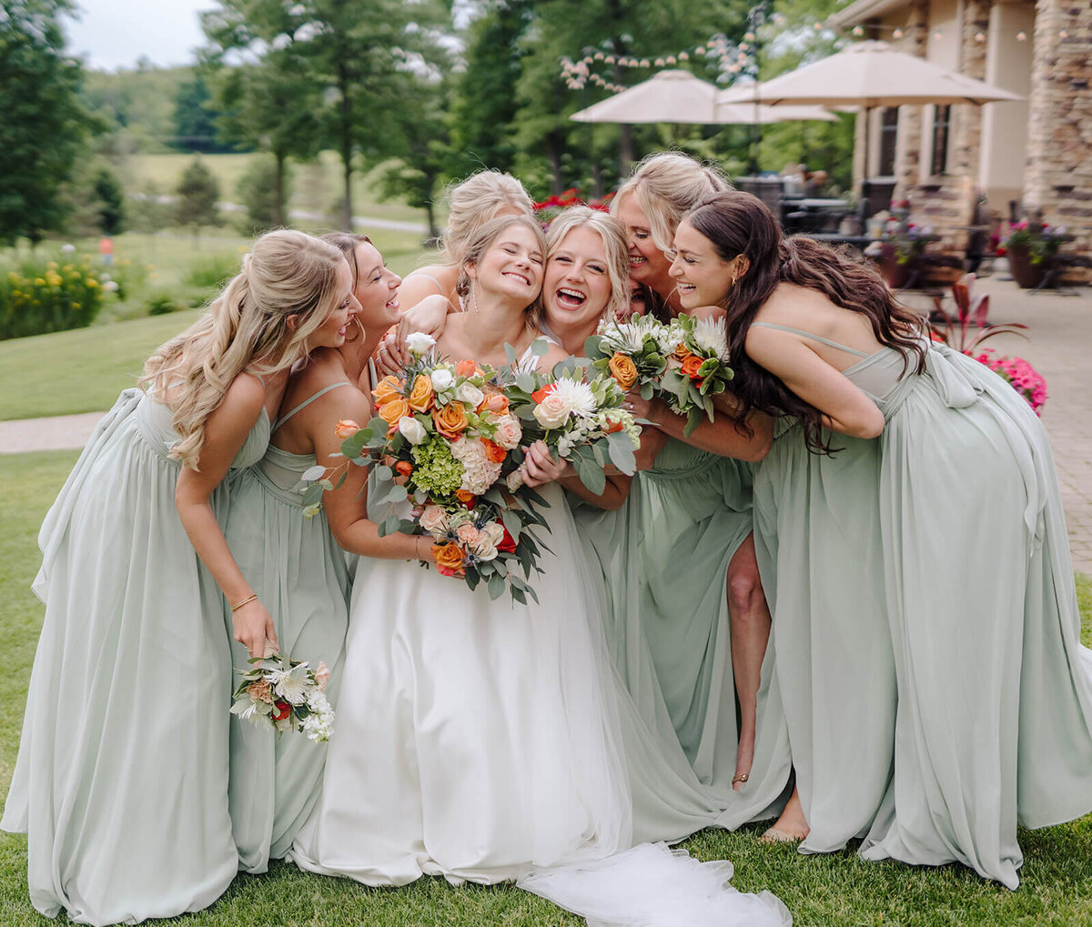 Bride with bridesmaids wearing plae green dreesses at Oswego wedding, NY