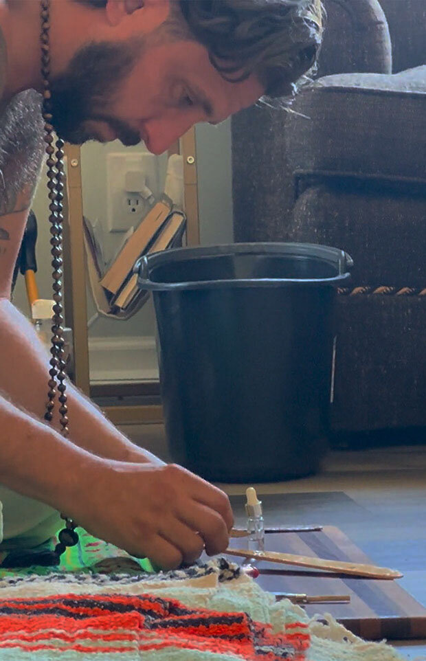 A photo of the Rising Ridge founder preparing kambo for a kambo ceremony for a veteran retreat.