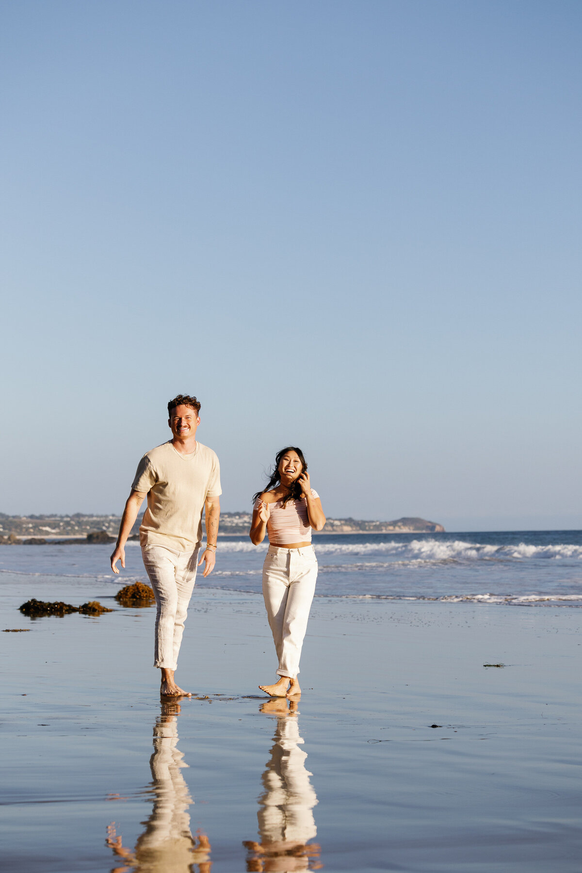 A couple walking along the beach together