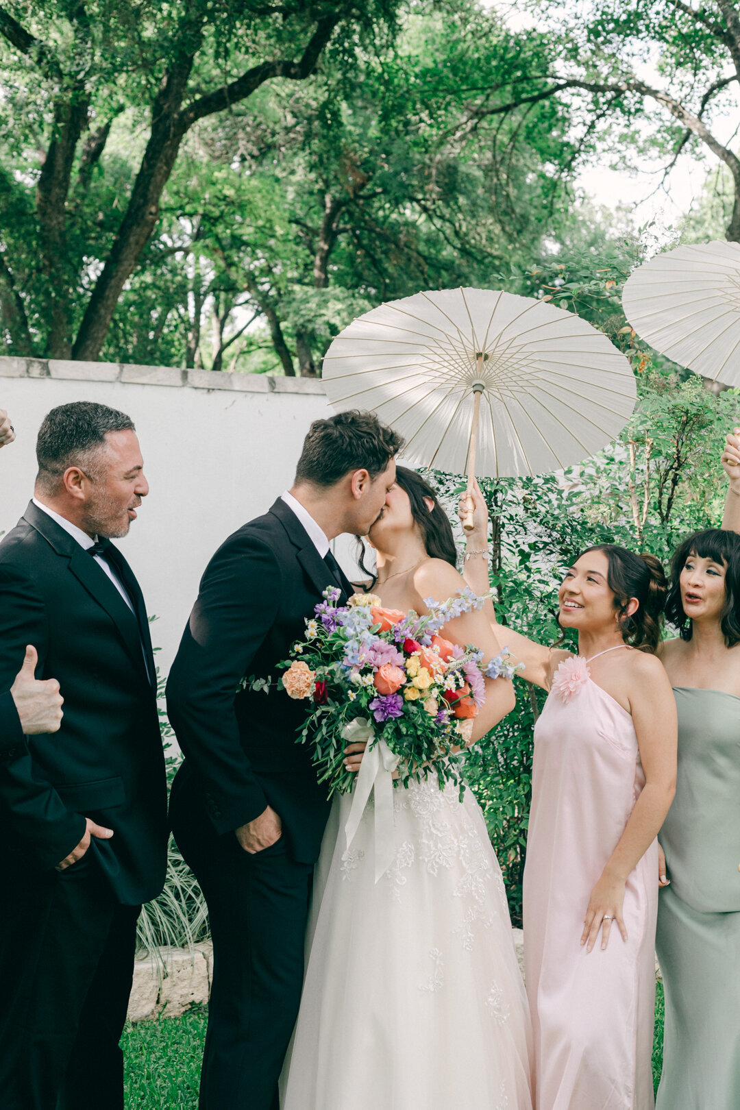 Bride and groom with wedding party at an intimate garden wedding in Austin, Texas Hill Country photographed by Marina Lazarine Photography.