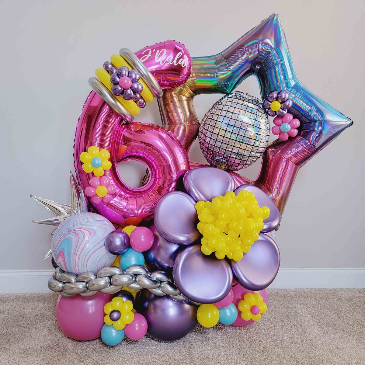 Girl's celebration with Air with Flair Decor's Premium Balloon Bouquet featuring a captivating Star and Purple Flower theme.