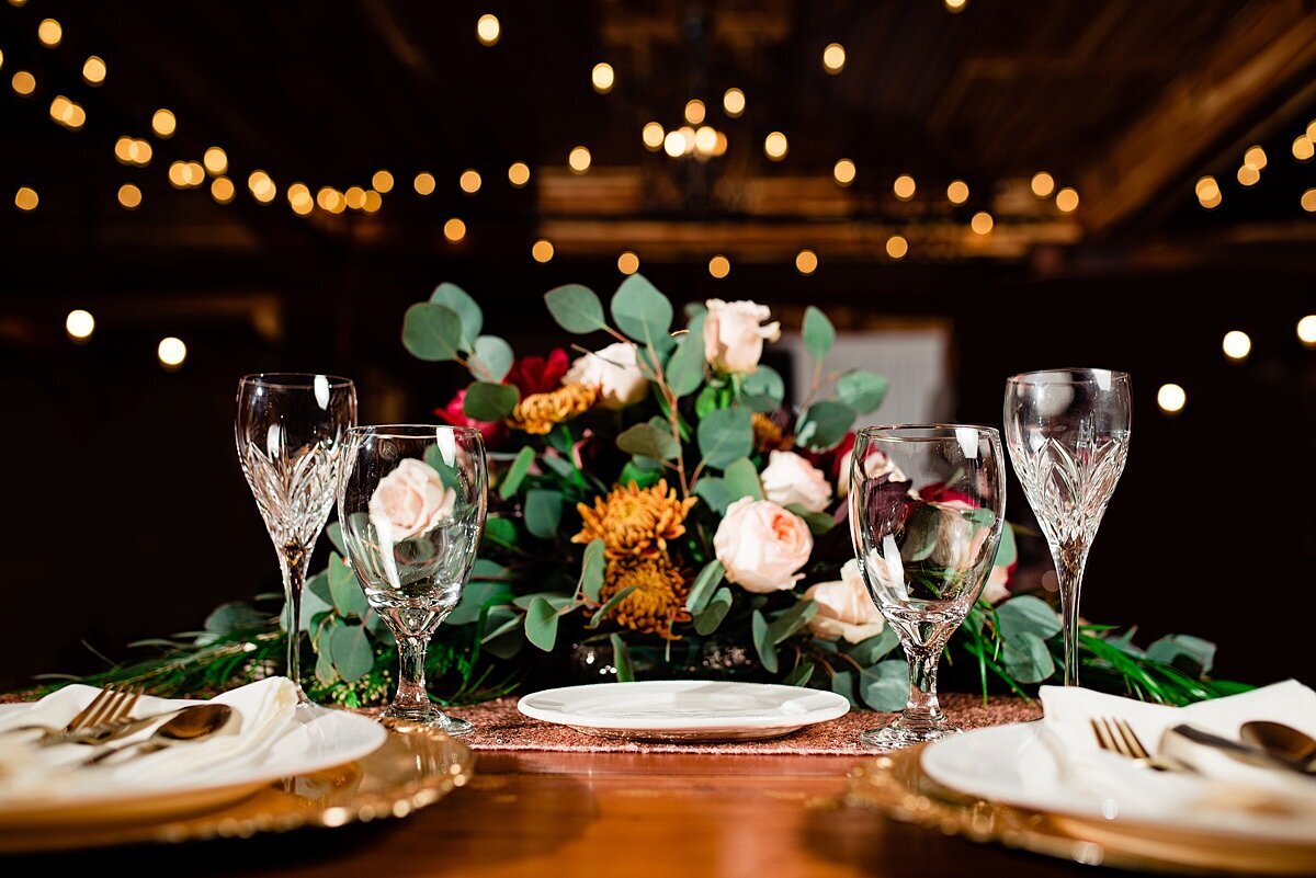 Detail photo of sweetheart table flowers and champagne flutes