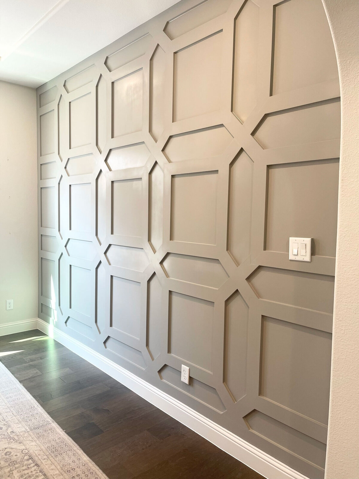 Interior contractor for an elegant home featuring stylish brown wall decorations that complement the sophisticated design and create a warm, inviting atmosphere in the living space.