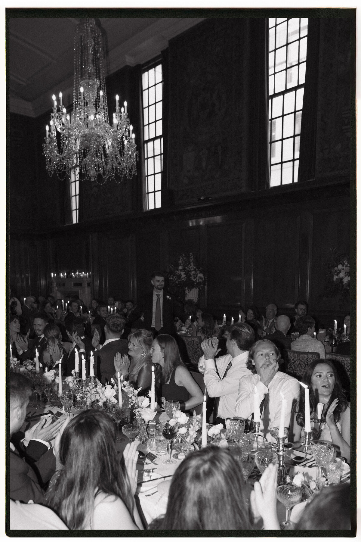 Wedding photographer captures couple taking a stroll hand in hand at their french chateau wedding.