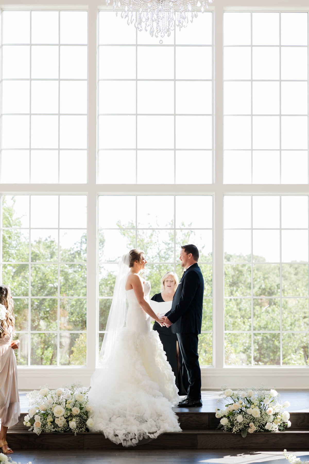 Kasey-and-JD-holding-hands-at-the-altar