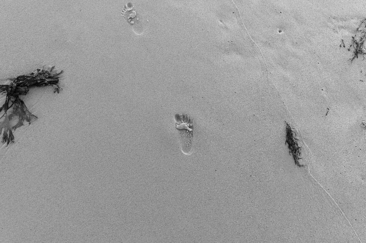 Toddler footprints on the beach in Nova Scotia.