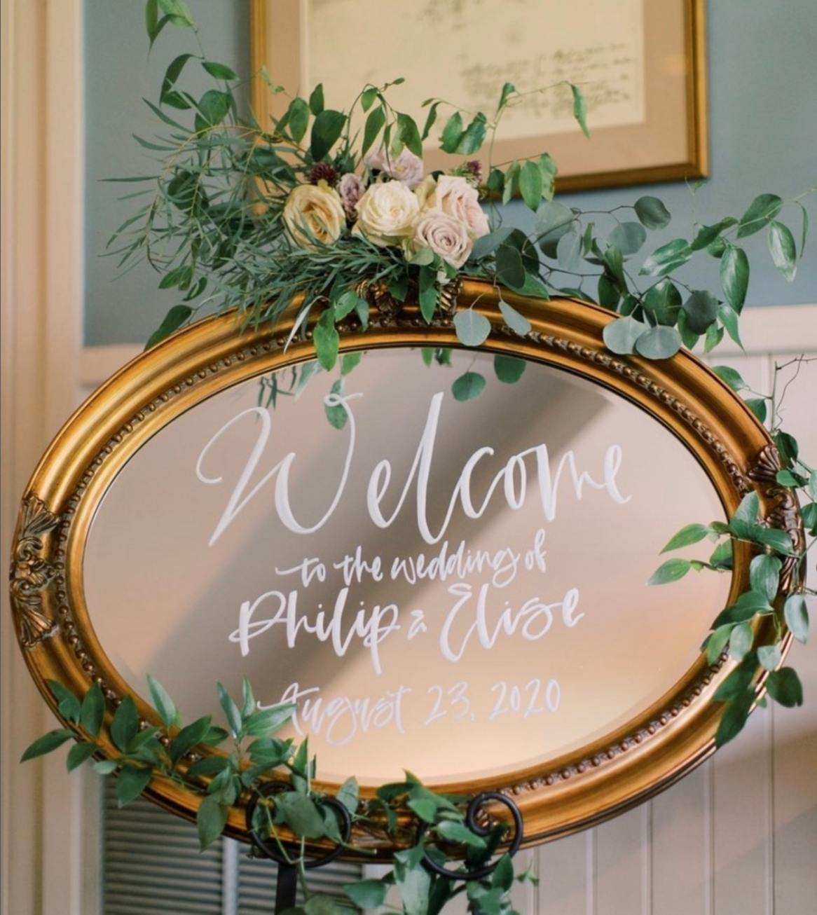 Calligraphy mirror welcome sign for a wedding