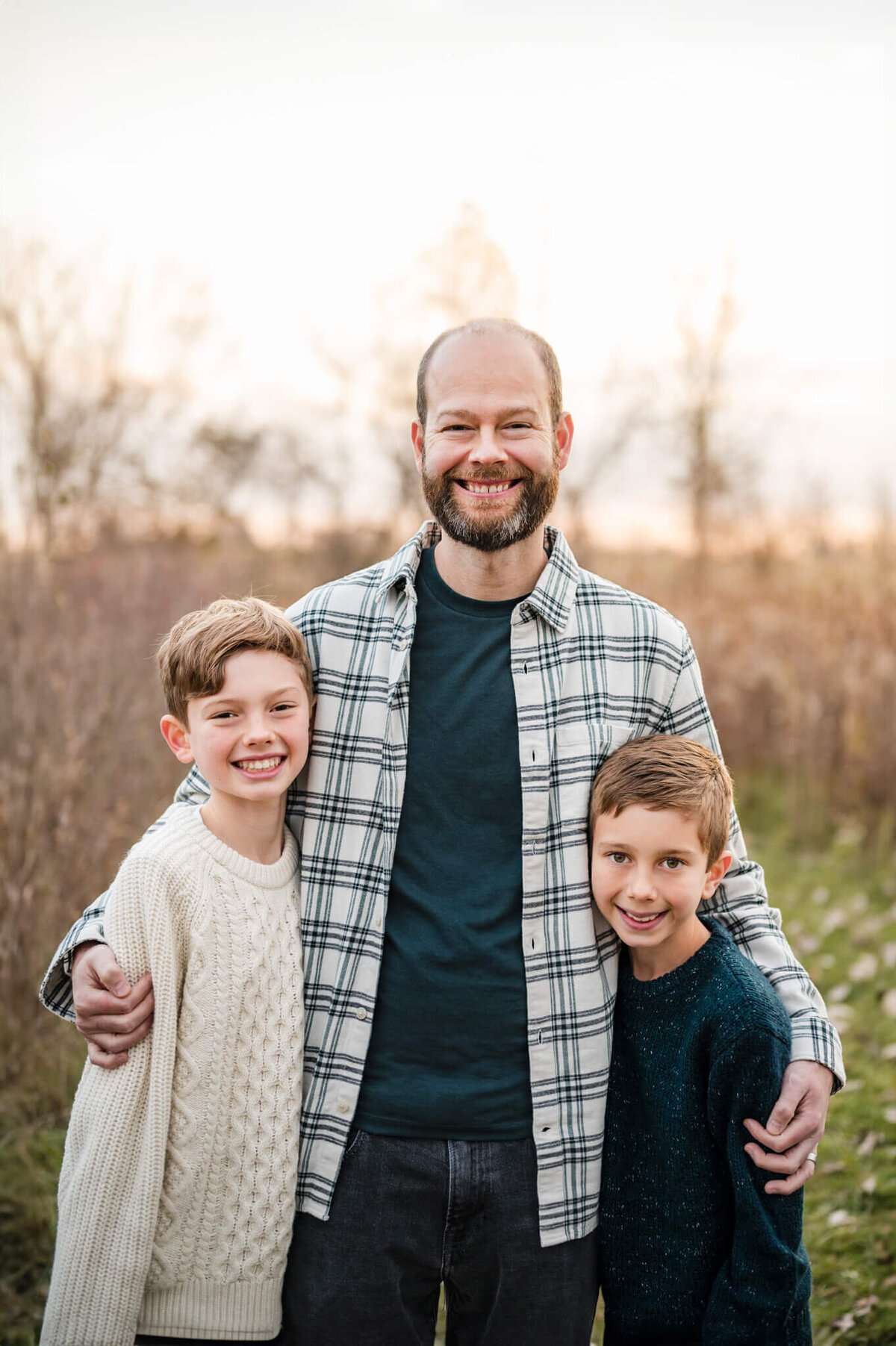dad and sons posing for a photo