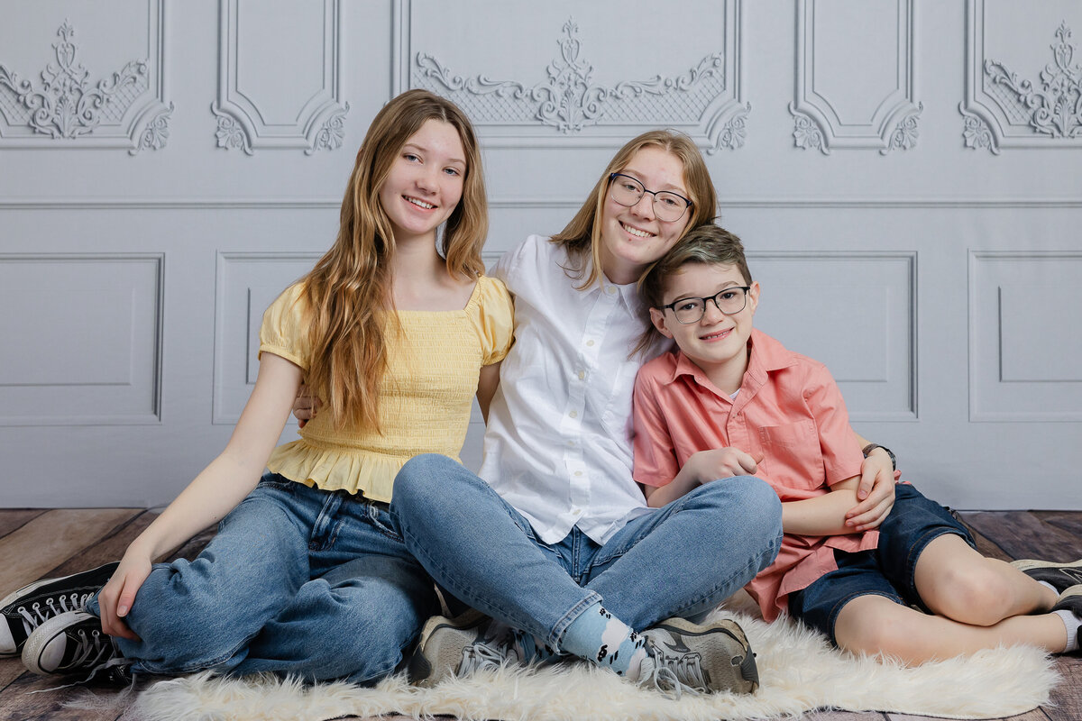Portrait of smiling siblings at Allison Reilly's Union County, NJ photo studio.