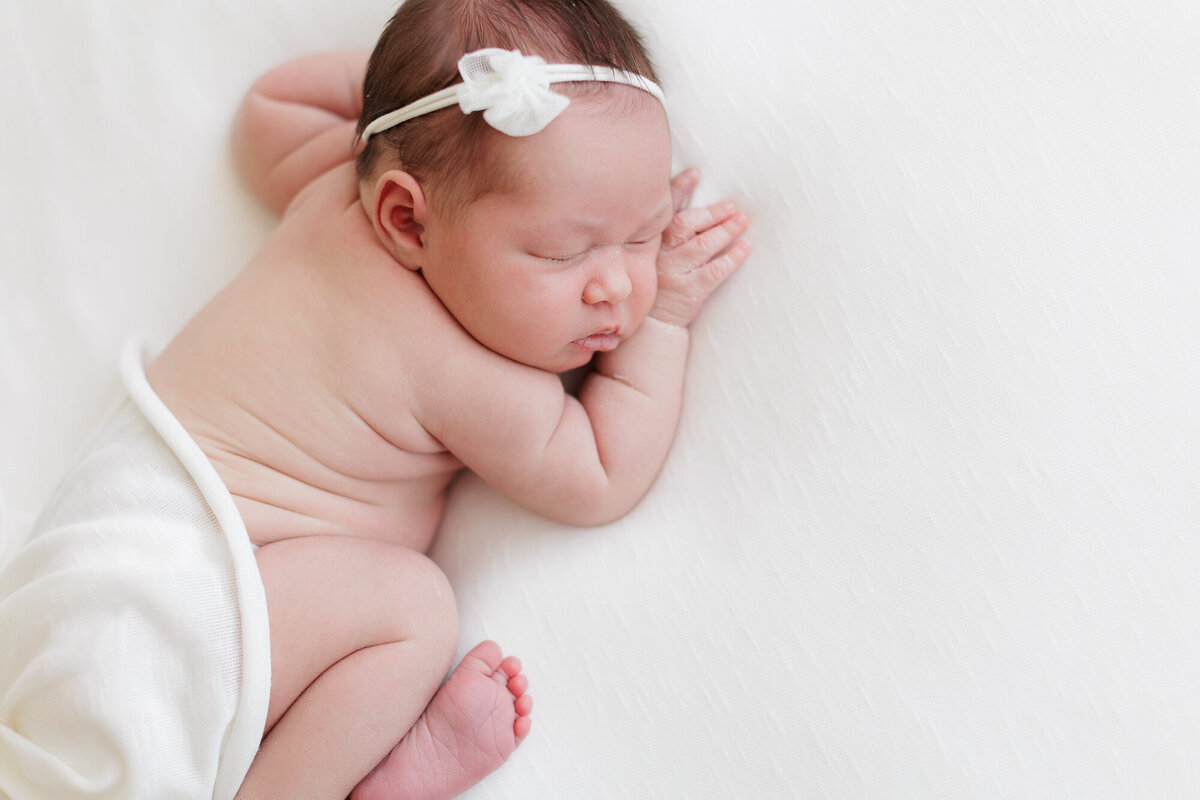 Newborn baby sleeping in Boise portriat studio.