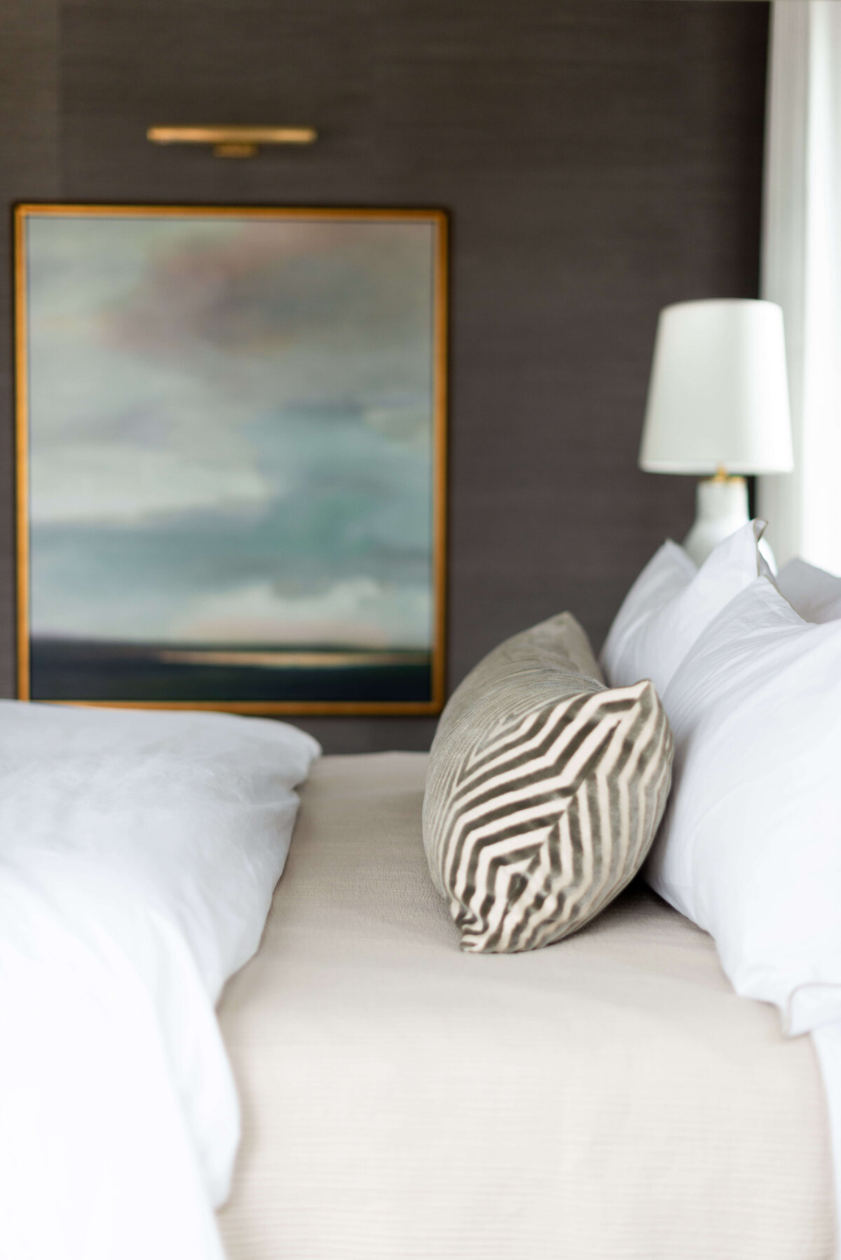 oyster creek studios building belt new build tan bed with landscape painting in bedroom