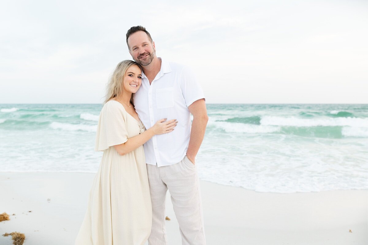 a father with his teen daughter in Destin at the beach