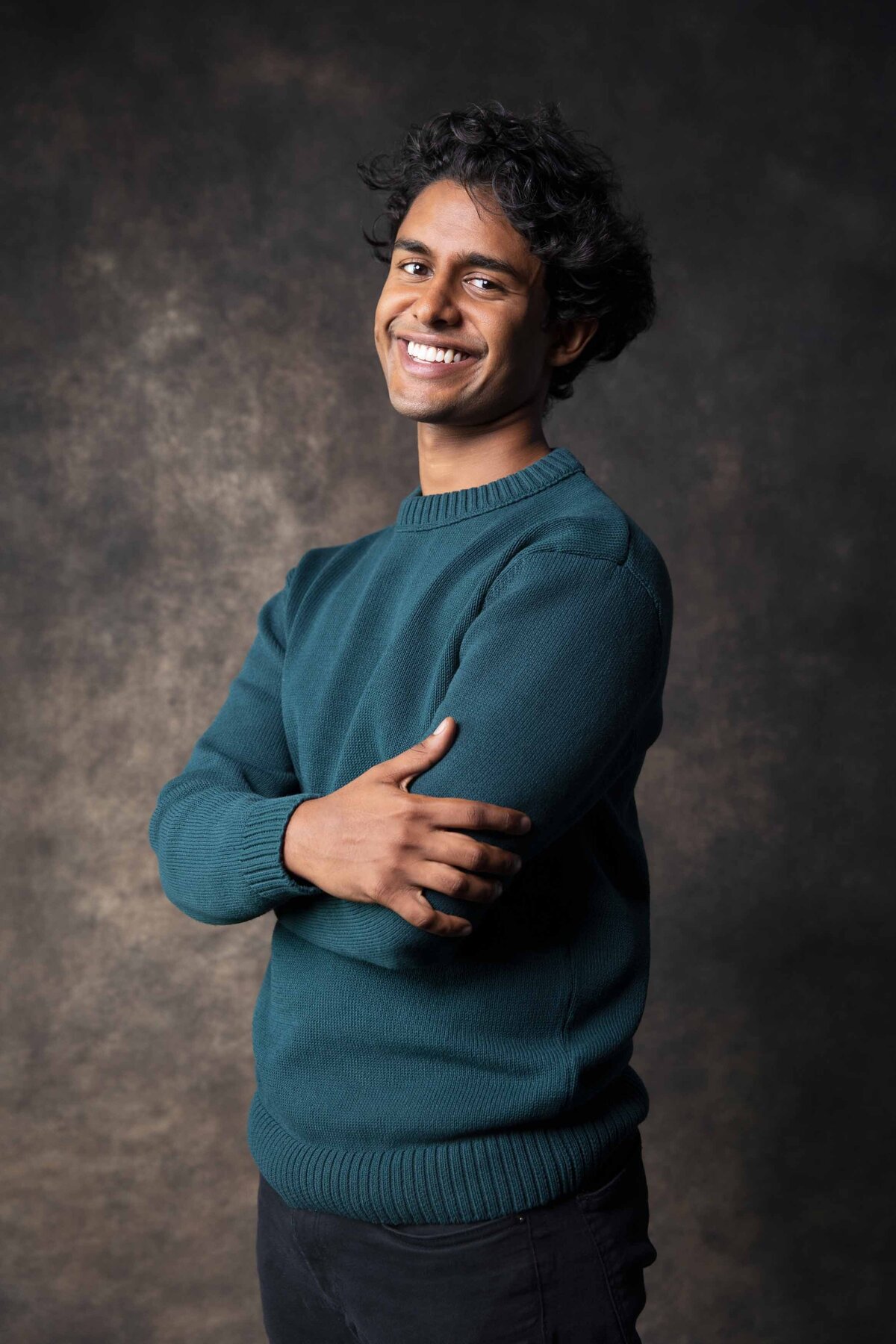 man-headshot-teal-sweater