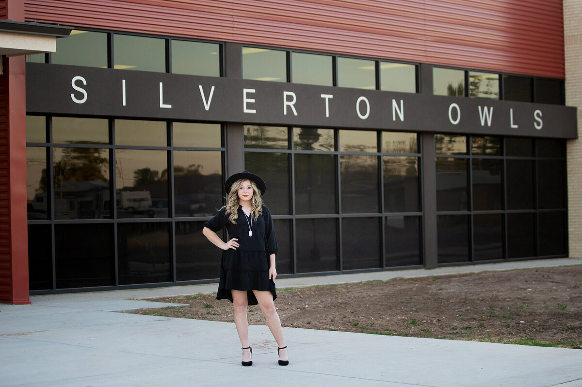 Silverton senior standing in front of the school