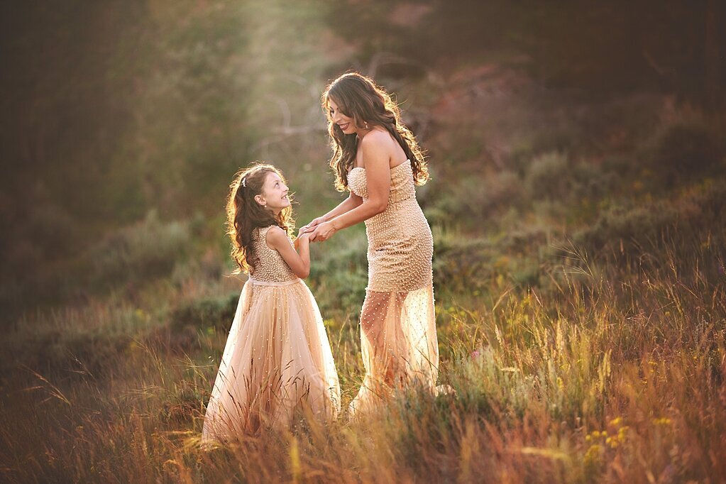 Mother and daughter picture in a summer field in the Medicine Bow Forrest.