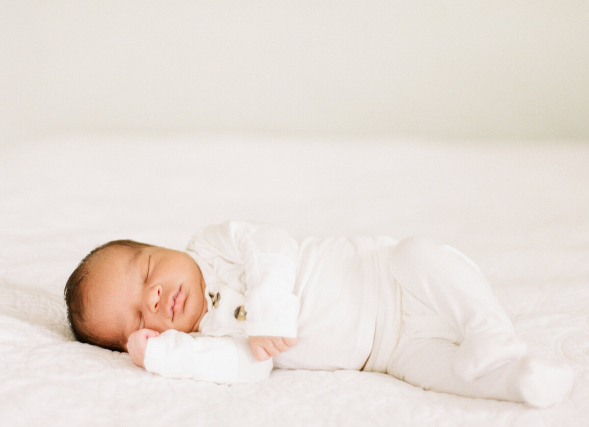 Baby sleeps peacefully during his Raleigh NC newborn session. Photographed by Raleigh Newborn Photographer A.J. Dunlap Photography.
