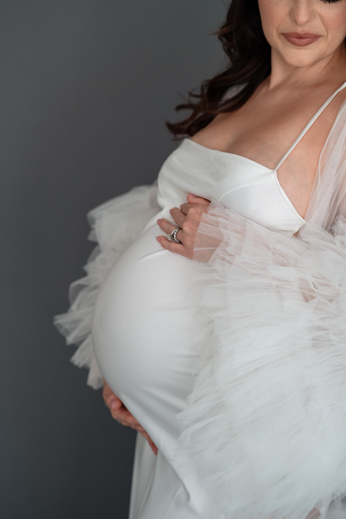 emmiclaire-maternity-bump-detail-hands-heart