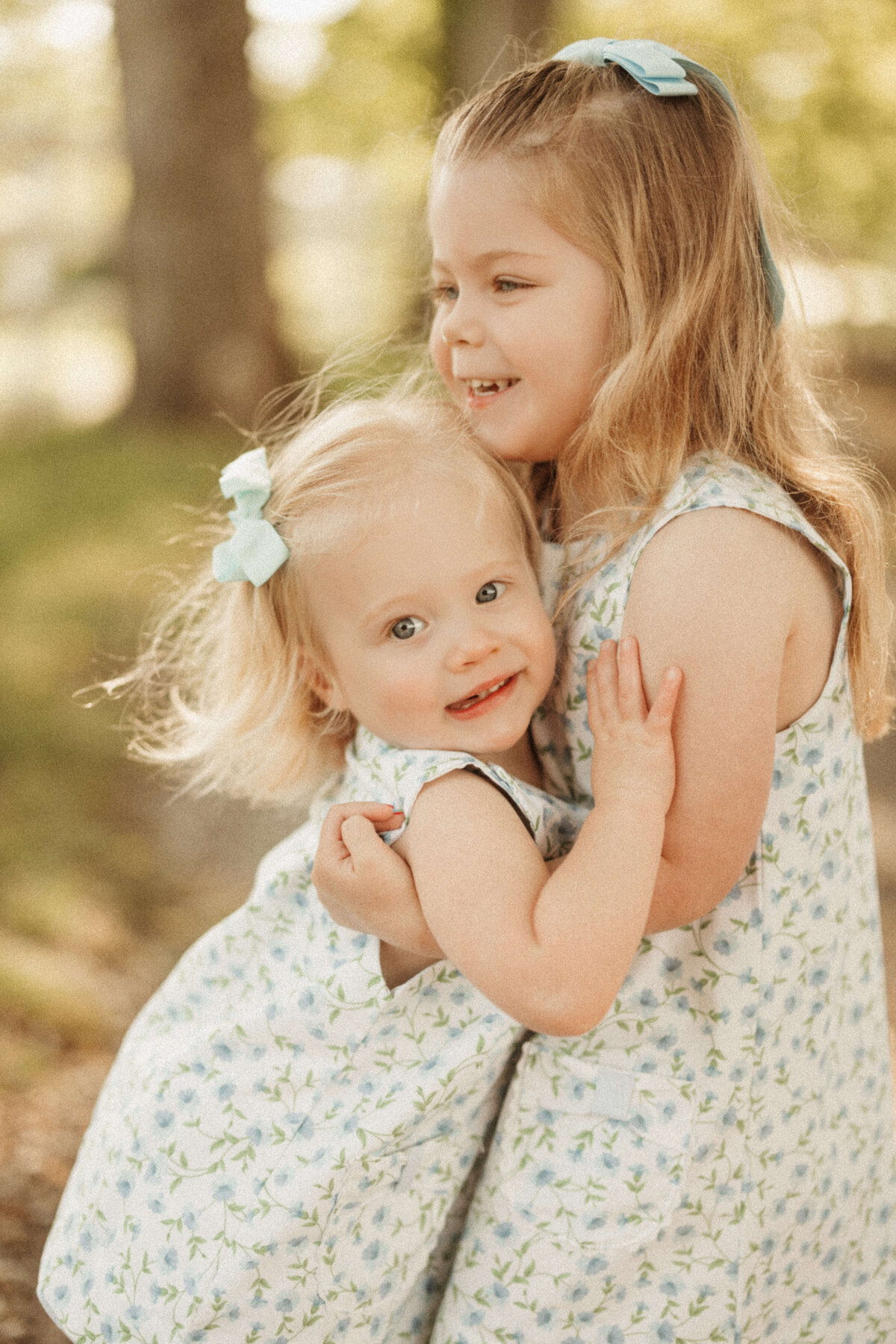 Family snuggling together on couch during Nashville Tennessee in-home photo session