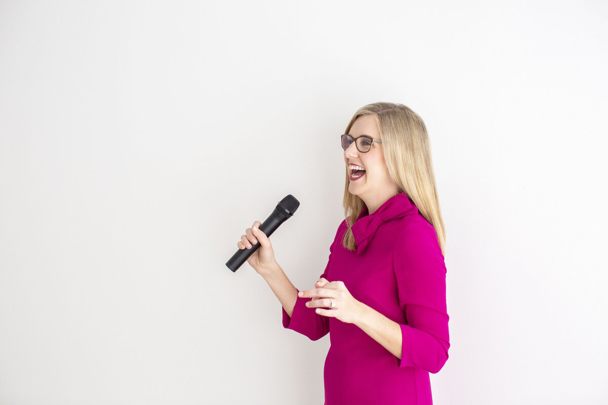 Vibrant portrait of woman in bright pink dress during her Philadelphia headshot session