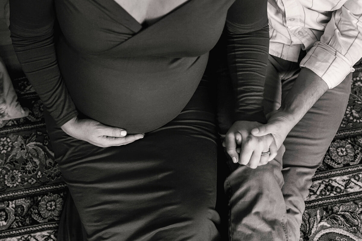 NJ Maternity photos of parents holding hands