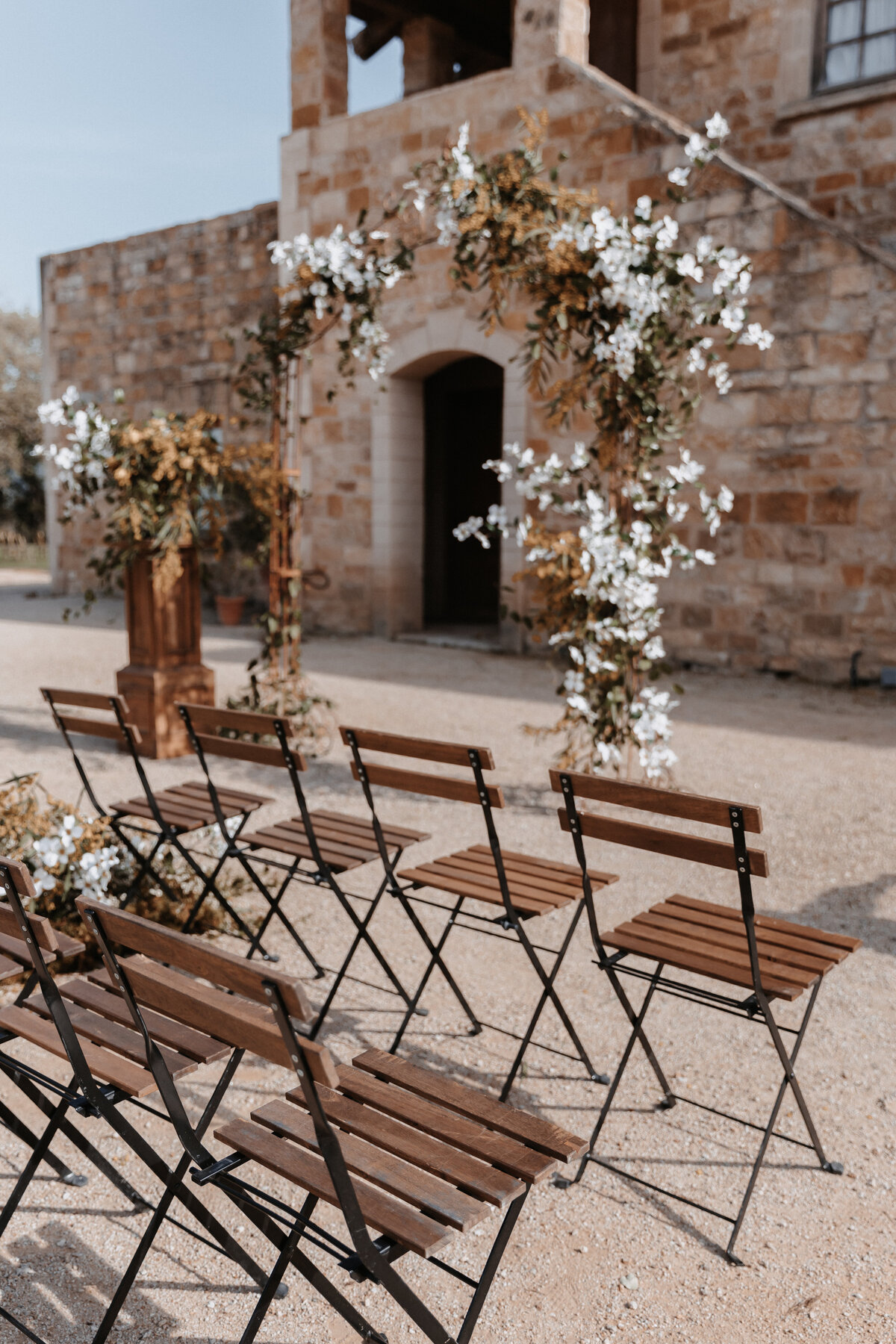 Sunstone Winery Ceremony wedding photo with white and yellow flowers