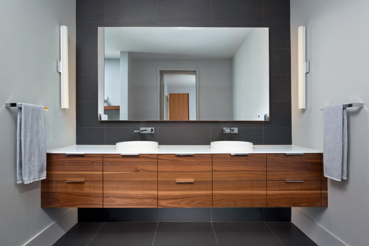 master bathroom with floating wood cabinets 