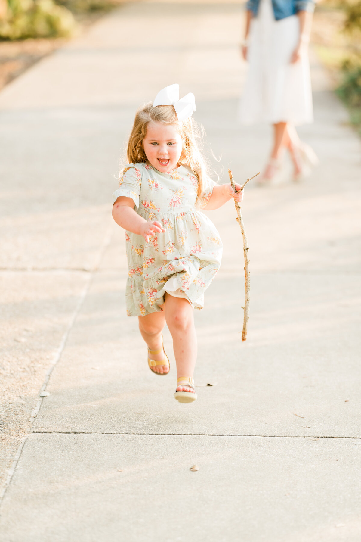 Little girl in a floral dress running