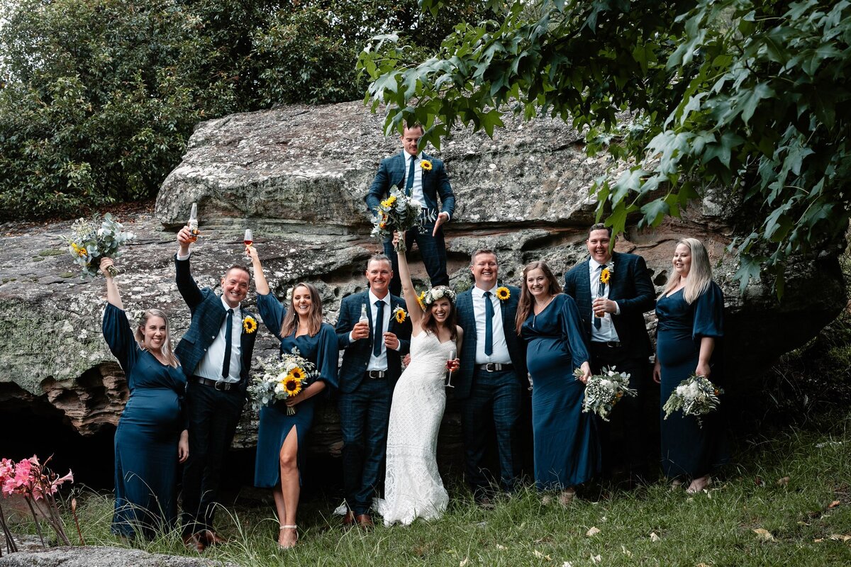 Kara & Ben together with their bridesmaids and groomsmen having a fun photoshoot!