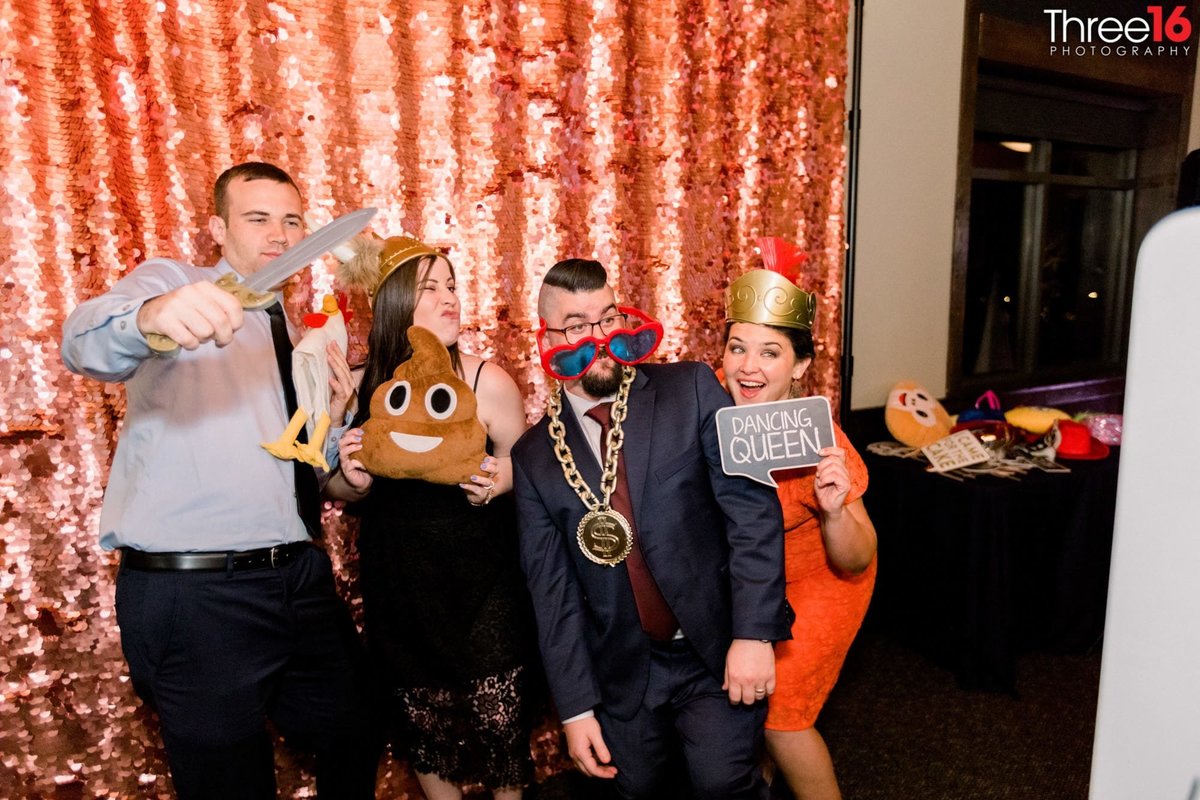 Wedding Guests goof off in the photo booth