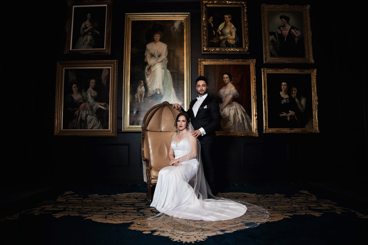 classy couple poses for wedding photos at Ritz Carlton Atlanta
