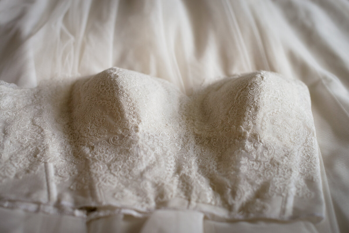 Close up of the detail work of the bodice of a wedding dress photographed by Austin TX Wedding Photographer Lydia Teague