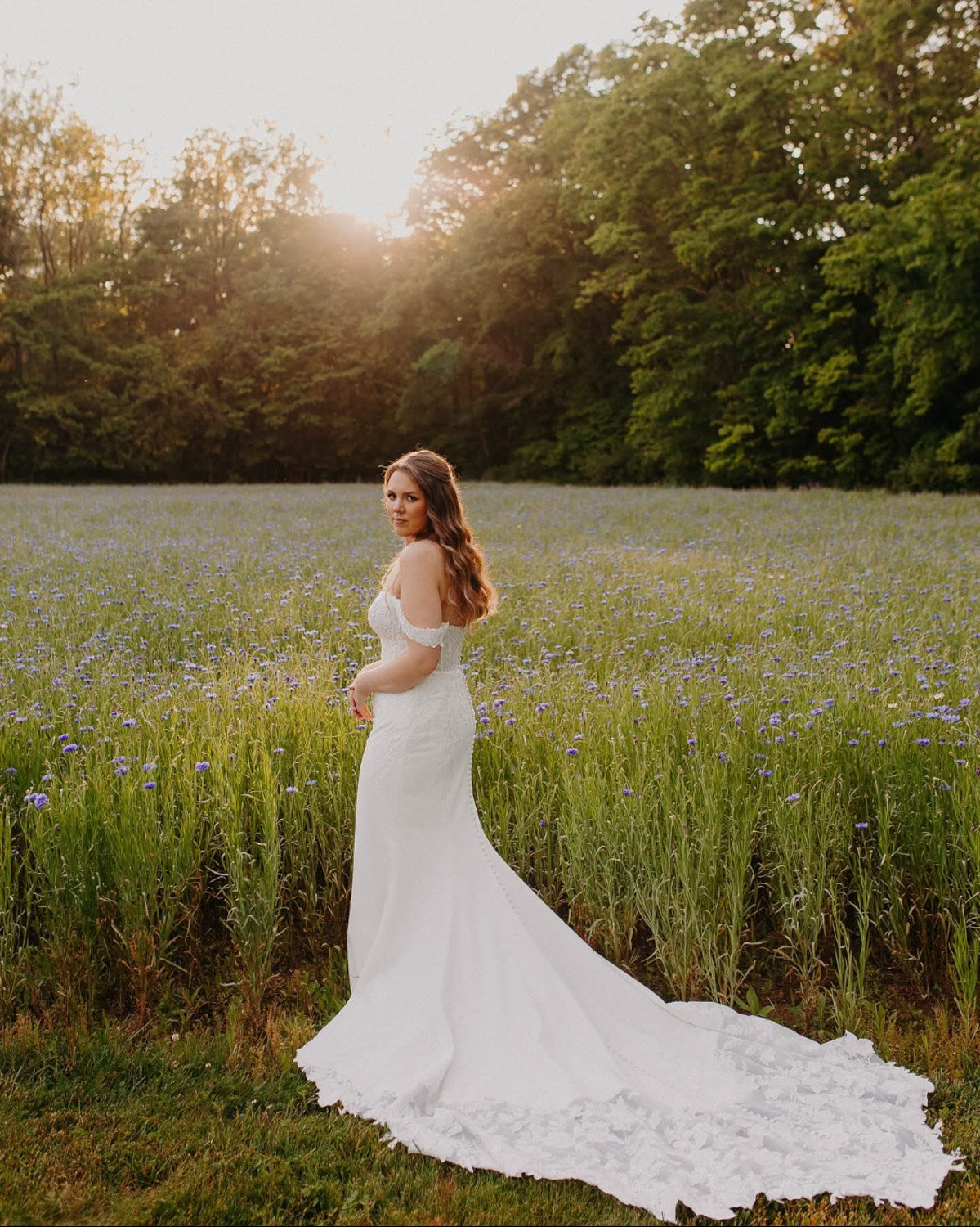 Bride walking outside near flowers