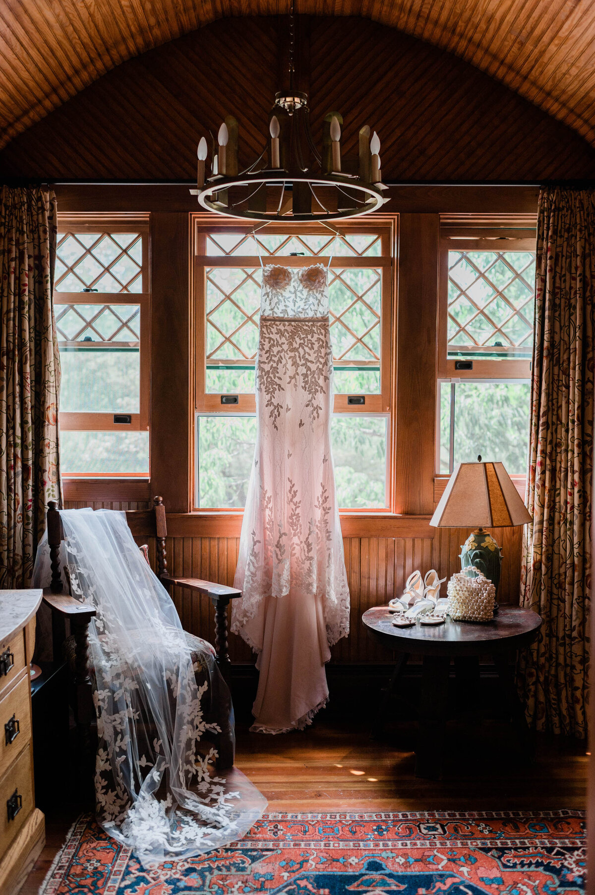 Bridal gown hands near a sunlit window