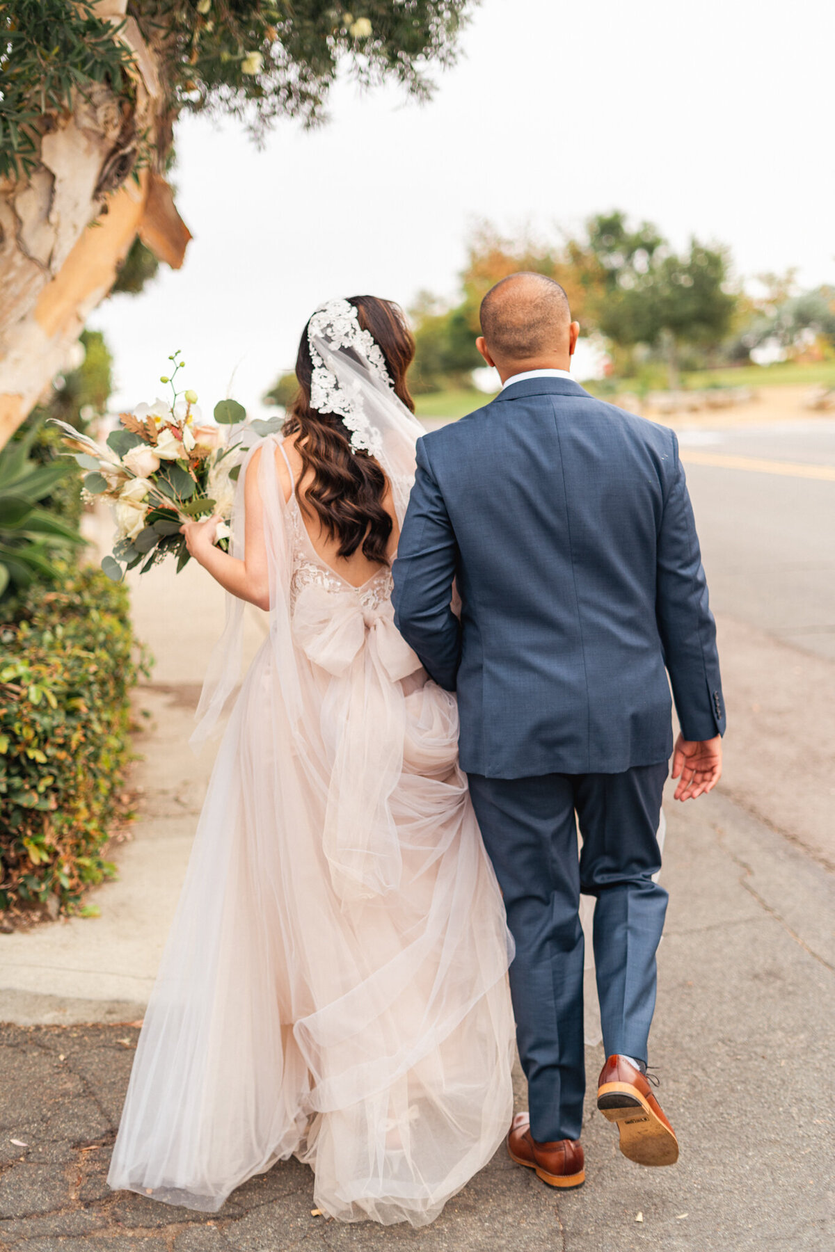 Bride and Groom walking hand in hand